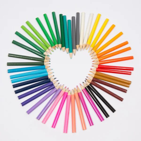 Colored pencils frame heart shaped — Stock Photo, Image