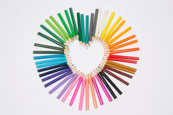 Colored pencils frame heart shaped — Stock Photo, Image