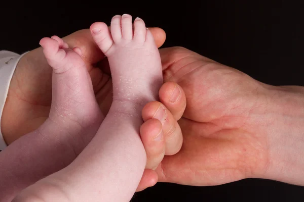 Leuke en mooie baby voeten, een macro — Stockfoto