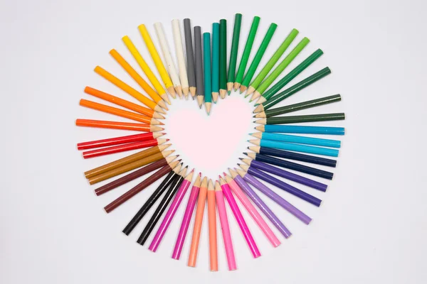 Smiling sun arranged from crayons and pencil — Stock Photo, Image