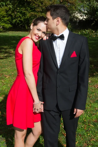 Young couple tuxedo and dress in love — Stock Photo, Image