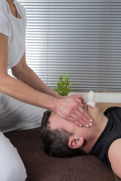 Therapist doing a shiatsu massage