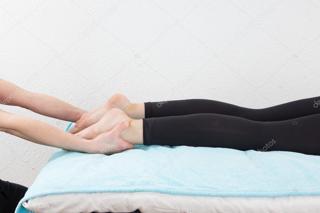 Woman legs massage at spa center