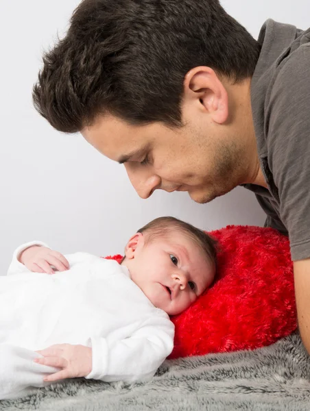 Loving father cuddling his new born baby — Stock Photo, Image