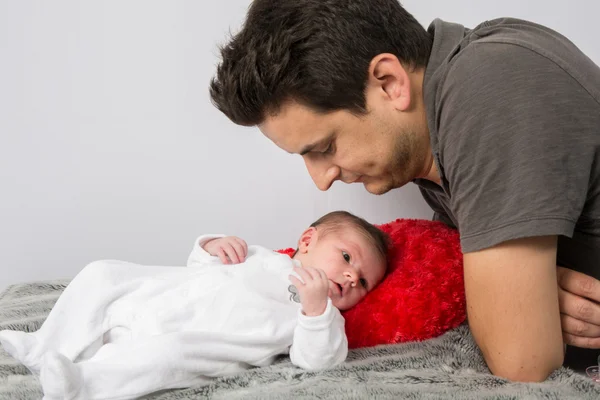Loving father cuddling his new born baby — Stock Photo, Image