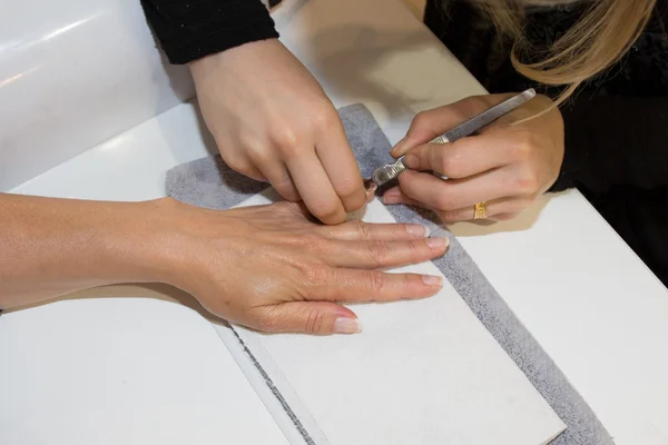 Close up of process of manicure at beauty salon — Stock Photo, Image