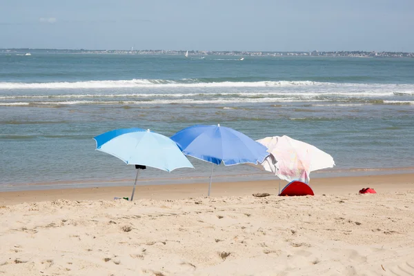 Three umbrella on the beach — Stock Photo, Image