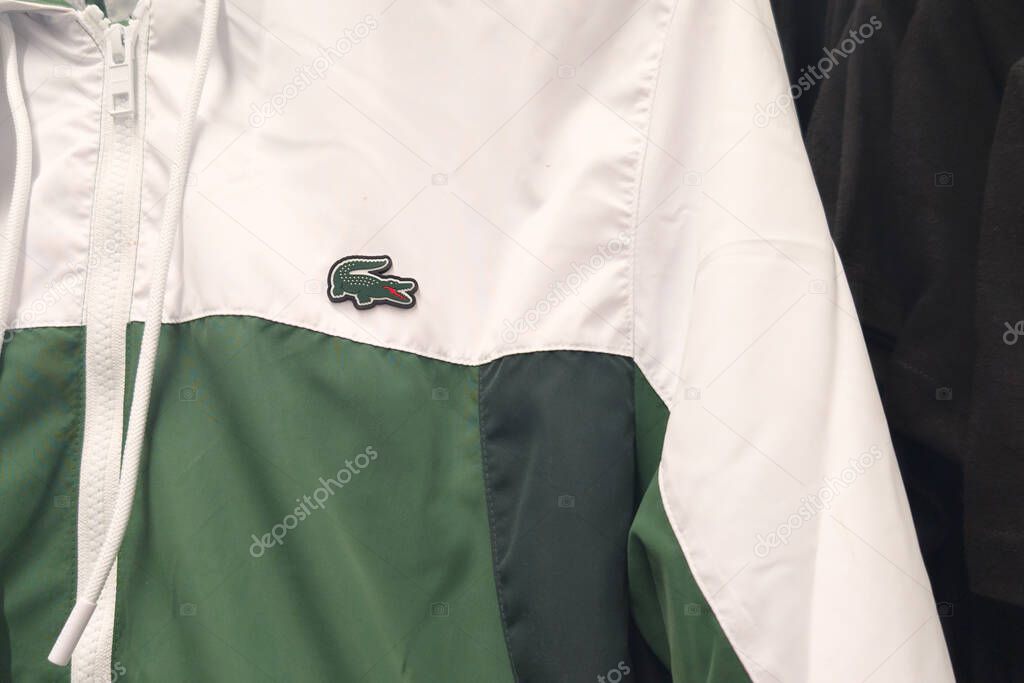 Bordeaux , france - 10 27 2025 : lacoste tracksuit sport logo brand interior shop and text sign in store of boutique fashion clothing chain french