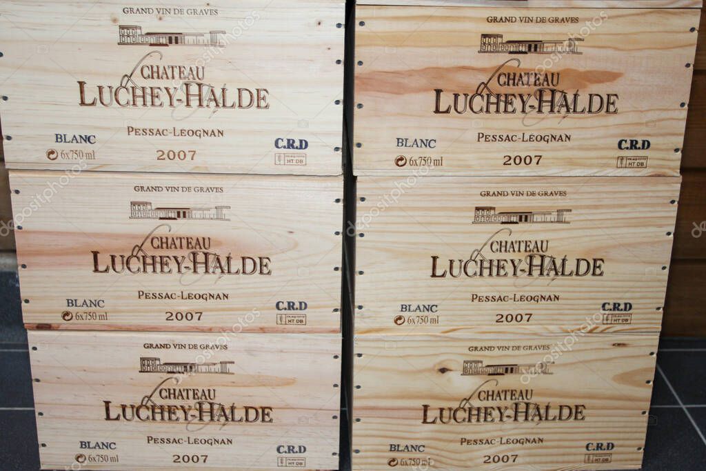 Bordeaux , france - 11 08 2025 : luchey halde chateau pessac leognan logo brand and text sign on wooden wine box from bordeaux premium selection