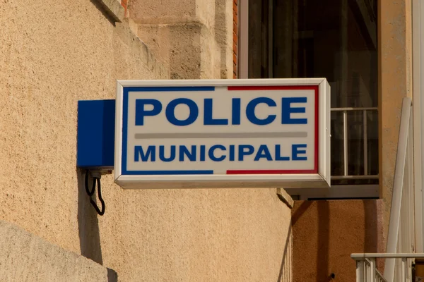 Policja Zaloguj francuskiego miasta pod budynek — Zdjęcie stockowe
