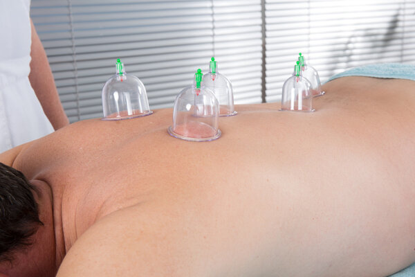 Alternative massage , a male having a chinese therapy to cure