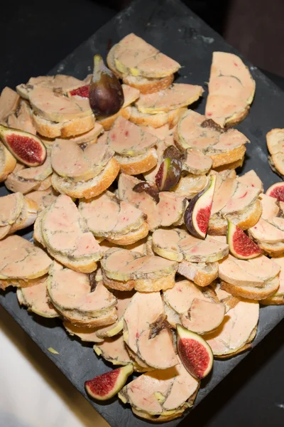 Grey plate with foie gras and fresh fig — Stock Photo, Image