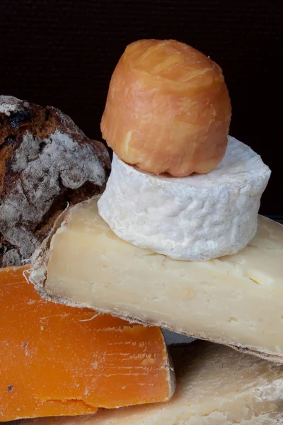 Tasty French cheese on a wooden table — Stock Photo, Image