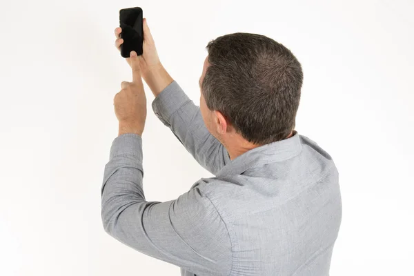 Współczesny człowiek robi autoportret na telefon — Zdjęcie stockowe