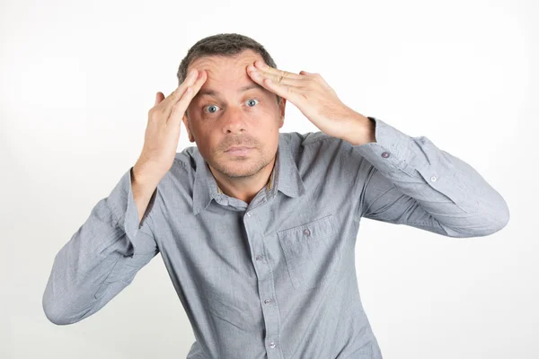 Middle-aged man  applying facial lotion — Stock Photo, Image