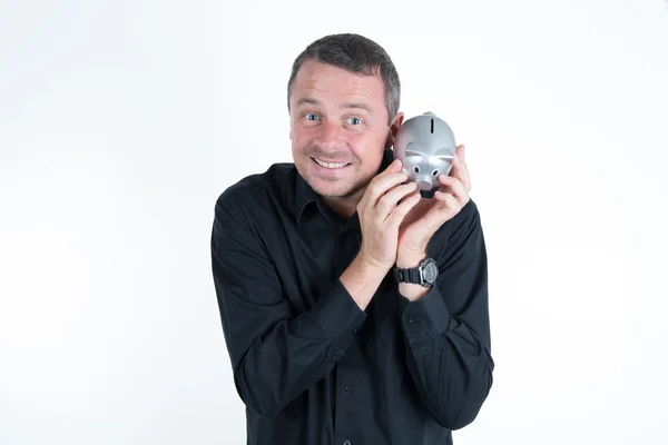 Man with a black shirt holding a piggy bank — Stock Photo, Image