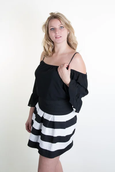 Young woman with a black and white dress — Stock Photo, Image