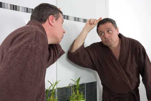 Middle-aged man in bathroom — Stock Photo, Image