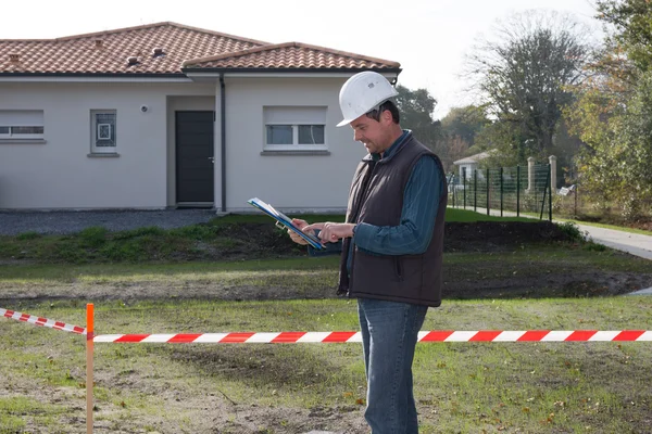 Engineer looking at his tablet — Stock Photo, Image