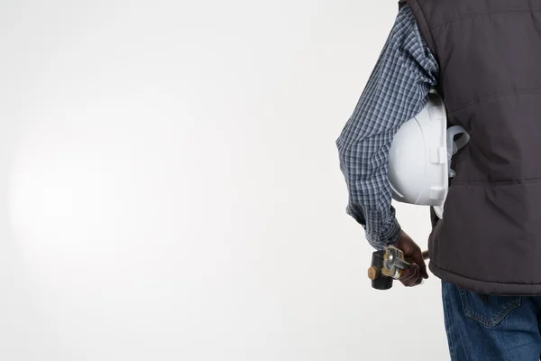 Rear view of a contractor standing on white with copy space — Stock Photo, Image