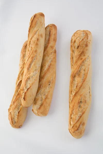 Pão de baguete francês isolado em branco — Fotografia de Stock