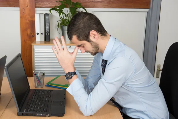 Horizontal view of man in depression in the office — Stock Photo, Image