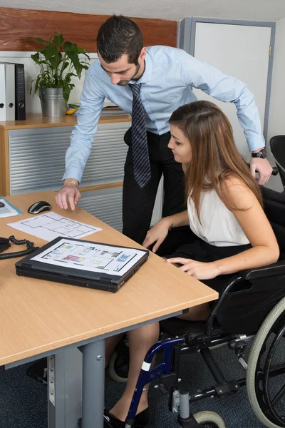 Handicapped happy woman attending a meeting in a bright office — Stock Photo, Image