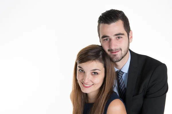 Cheerful young couple standing on white background, — Stock Photo, Image