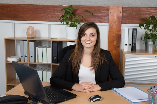 Portrait of serious business woman at work in a bright office — Stock Photo, Image