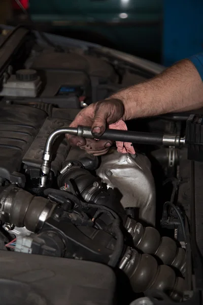 Hands of car mechanic in auto repair service. — Stock Photo, Image