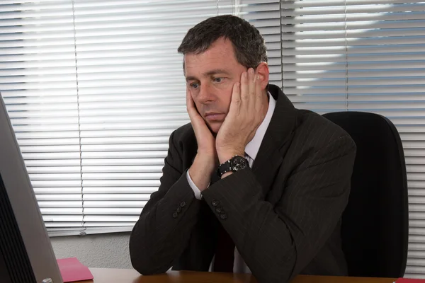 Mature businessman visibly bored and disappointed — Stock Photo, Image
