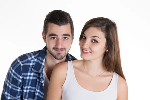 Pareja joven y feliz de pie sobre fondo blanco —  Fotos de Stock