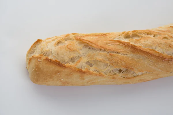 A baguete francesa isolada sobre um fundo branco — Fotografia de Stock