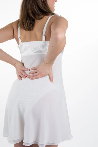 A Back view of a woman having a backache — Stock Photo, Image