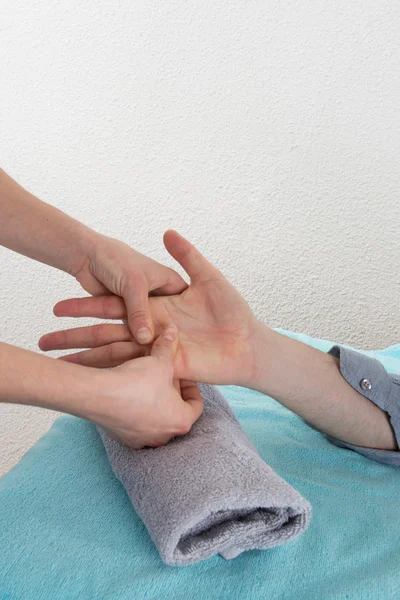 Man getting a hand massage (close up on hands) — Stock Photo, Image