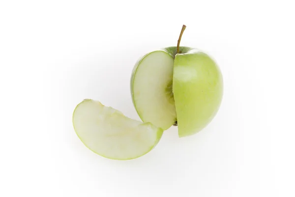 Green apple and slice isolated over white background — Stock Photo, Image