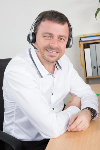 Handsome technical support operator working on computer — Stock Photo, Image