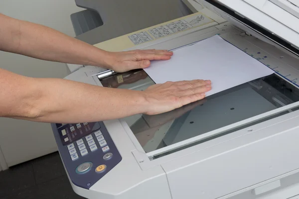 Happy secretary using  photocopy machine in  office — Stock Photo, Image