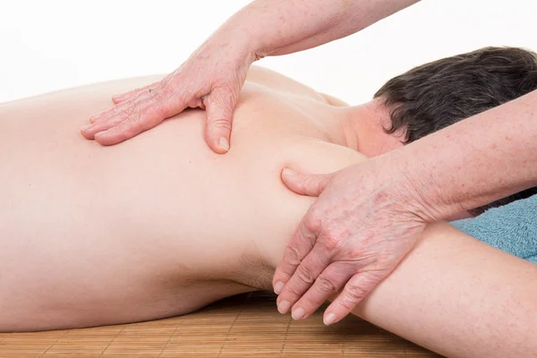 Physiotherapist doing shoulder massage to  patient in medical office — Stock Photo, Image