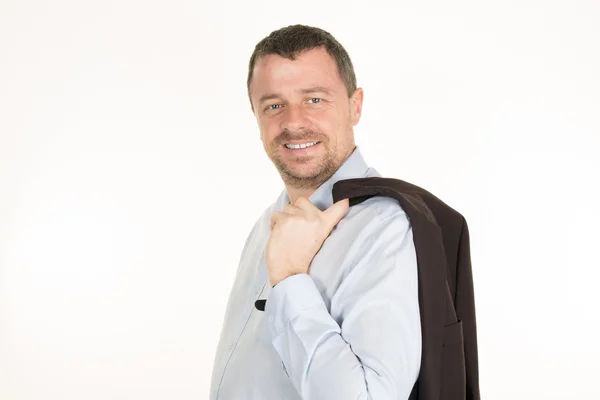 Lachen ontspannen zakenman staat met pak jasje over zijn schouder — Stockfoto