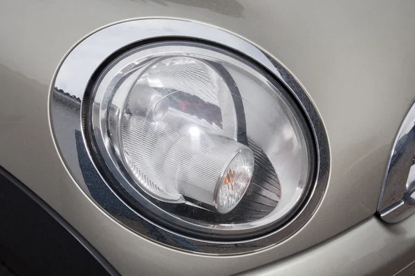 Close up of a grey car headlight — Stock Photo, Image