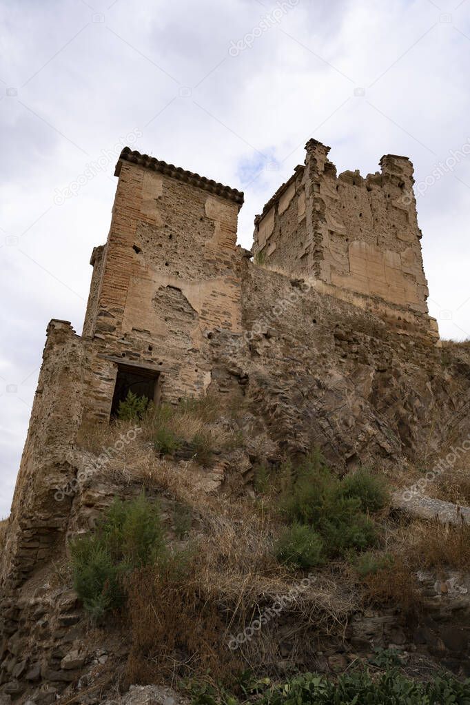 tower of a ruined castle with the photo taken from below