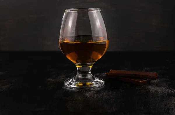Glass Cognac Dark Chocolate Wooden Background — Stock Photo, Image