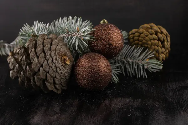 Spruce Snow Cones Brown Christmas Balls Close Dark Wooden Background — Stock Photo, Image