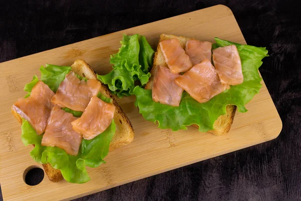 Two Salmon Sandwiches Light Wooden Board Top View — Stock Photo, Image