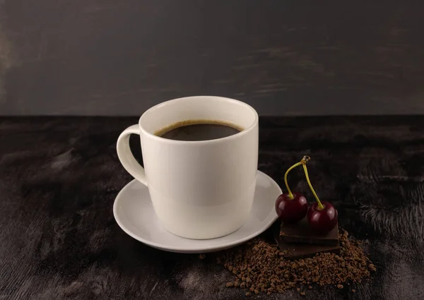 Cup Black Coffee Ripe Cherries Dark Chocolate Dark Wooden Background — Stock Photo, Image