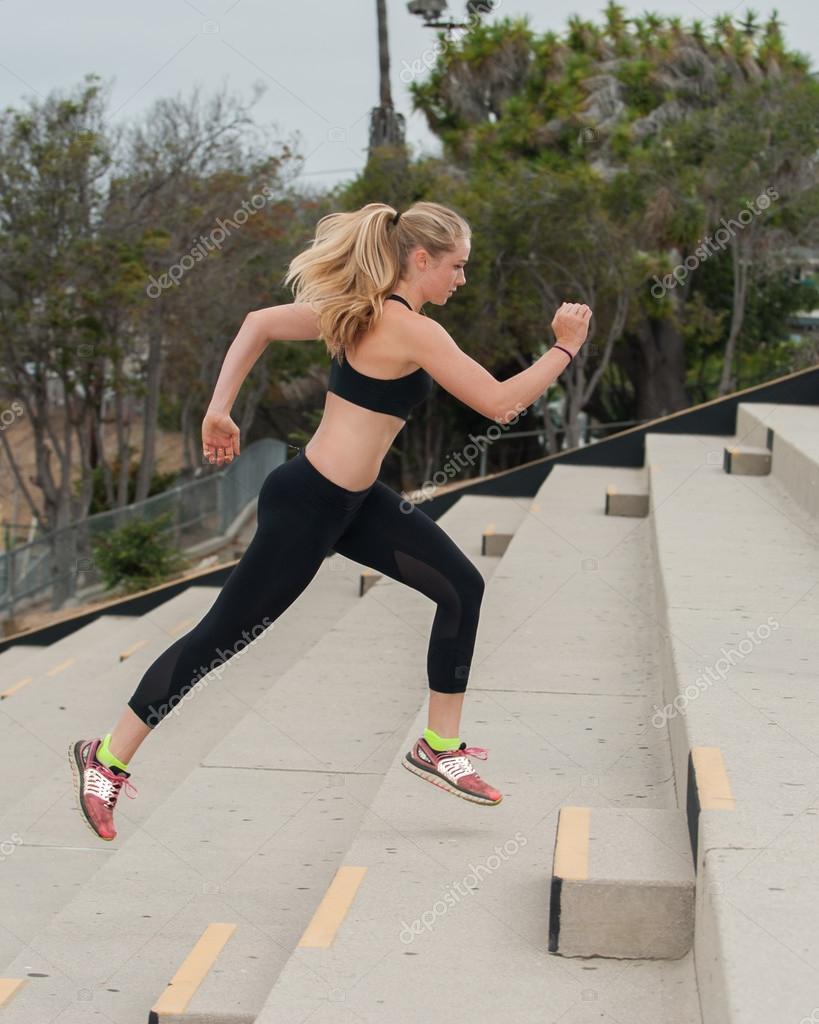 girl running in sports bra