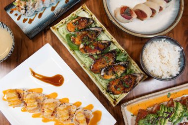 Table feast of sushi favorites and appetizers with the always perfect presentation.
