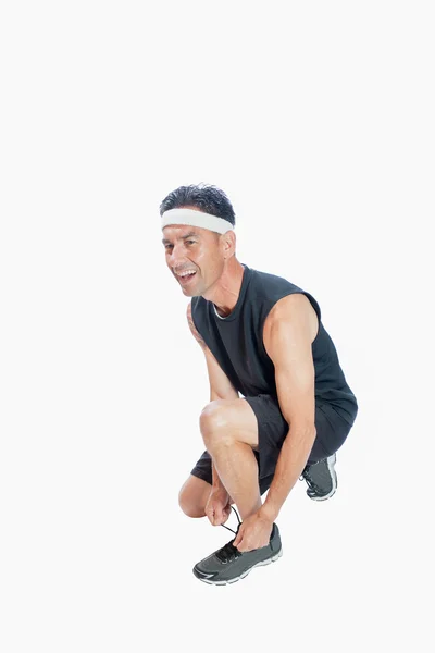 Runner tying the shoe laces — Stock Photo, Image