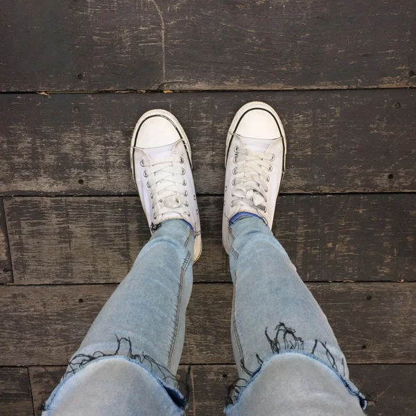 Fashion hipster cool woman with white sneakers, soft vintage toned colors great for any use. — Stock Photo, Image